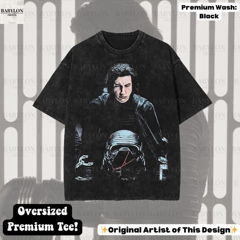 May include: Black oversized premium tee with a graphic of a science fiction character. The image includes the text "Premium Wash: Black", "Oversized Premium Tee!" and "Original Artist of This Design".