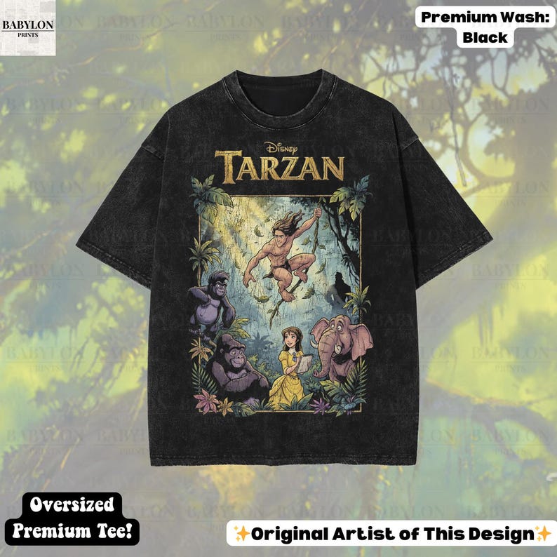 May include: Black oversized premium tee featuring a colorful graphic of Disney's Tarzan. The design includes Tarzan, Jane, gorillas, and an elephant. The shirt has the text "Disney Tarzan" across the top.