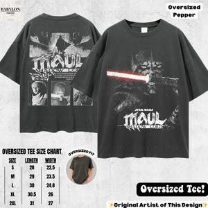 May include: Two dark gray oversized t-shirts. One features a graphic of Darth Maul with a red lightsaber and the text "STAR WARS MAUL SHADOW LORD." The other shirt displays a graphic of Darth Maul and the text "MAUL SHADOW LORD."