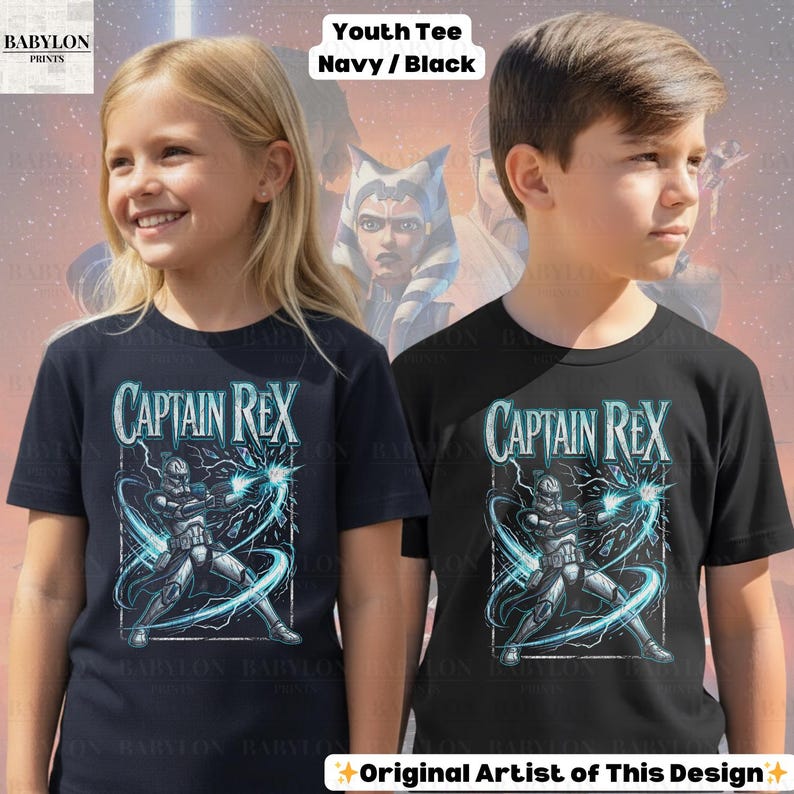 May include: Two youth t-shirts, navy and black, with the text "CAPTAIN REX". The graphic shows a character with blue energy effects. The shirts are labelled "Youth Tee Navy/Black" and are from "BABYLON PRINTS".