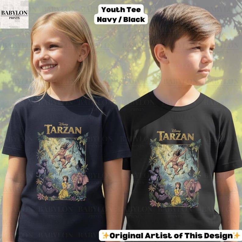 May include: Two youth t-shirts, one navy blue and one black, featuring a Disney Tarzan graphic. The graphic includes Tarzan, Jane, and various jungle animals. The text "Youth Tee Navy/Black" is at the top. The text "Original Artist of This Design" is at the bottom.