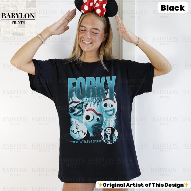 May include: Black t-shirt featuring the word "FORKY" in teal, with a graphic of Forky from Toy Story. The shirt also includes the text "I'M NOT A TOY. I'M A SPORK!" and the Babylon Prints logo.