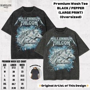 May include: Black and pepper-colored oversized t-shirts with a large graphic print of the Millennium Falcon spaceship, with the text "Millennium Falcon" in a metallic font. The shirts have a distressed wash effect.