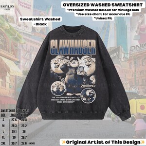 May include: Black oversized washed sweatshirt featuring a graphic of Clawhauser from Zootopia. The sweatshirt includes the text "CLAWHAUSER" and "ZOOTOPIA". Made of premium washed cotton for a vintage look. Available in sizes S to 2XL.