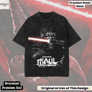 May include: Black oversized premium tee featuring a graphic of Darth Maul from Star Wars with a red lightsaber. The shirt has the text "STAR WARS MAUL SHADOW LORD". The shirt is labeled "Premium Wash: Black" and "Oversized Premium Tee!"