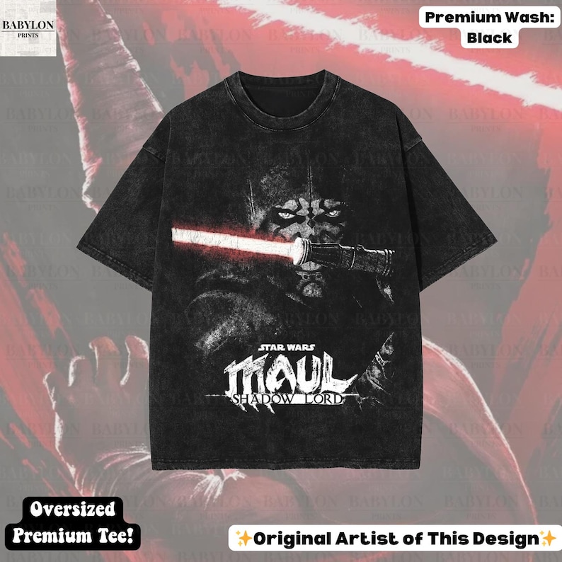 May include: Black oversized premium tee featuring a graphic of Darth Maul from Star Wars with a red lightsaber. The shirt has the text "STAR WARS MAUL SHADOW LORD". The shirt is labeled "Premium Wash: Black" and "Oversized Premium Tee!"