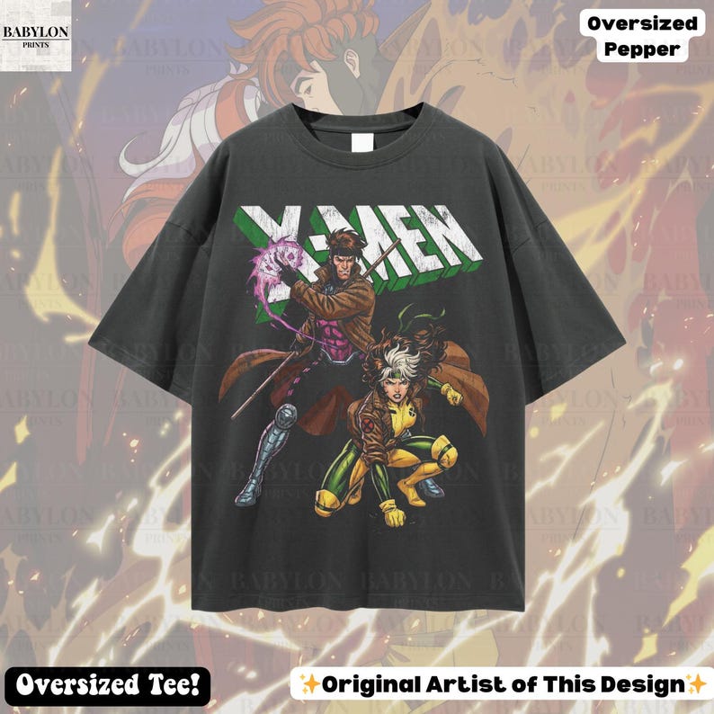 May include: Dark gray oversized t-shirt featuring the X-Men logo and comic book characters Gambit and Rogue. The shirt has the text "Oversized Tee!" and "Original Artist of This Design" printed on it.