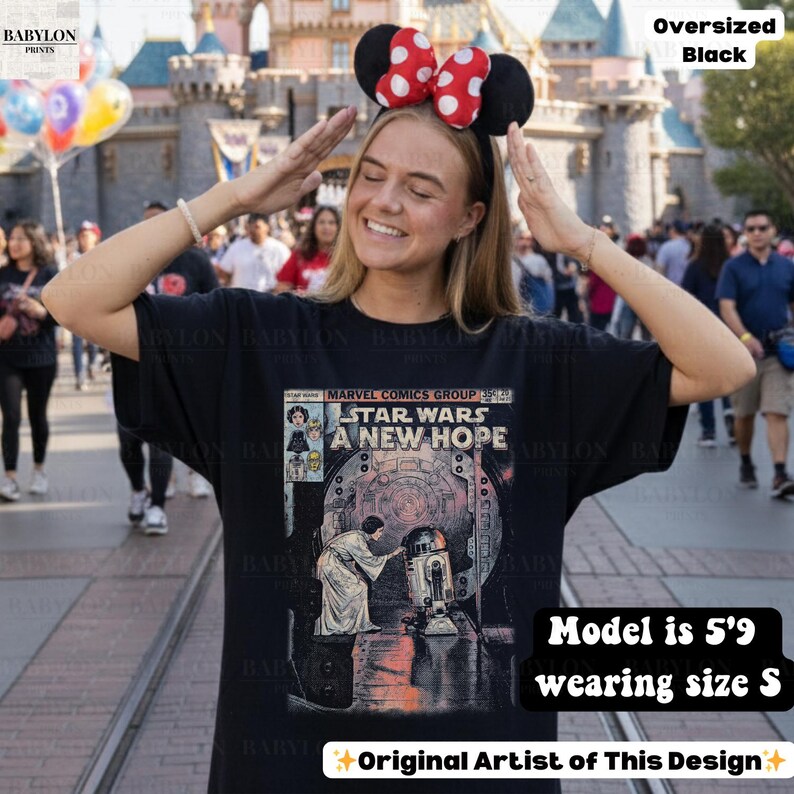 May include: Black oversized t-shirt featuring a Star Wars comic book cover design. The graphic includes the text "STAR WARS A NEW HOPE" and images of characters. The model is 5'9 and wearing size S.