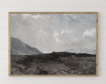 May include: A wooden bench with two pillows, a vase with dried pampas grass, a ceramic bowl, and two white lanterns. The bench is in front of a white wall with a framed landscape painting.