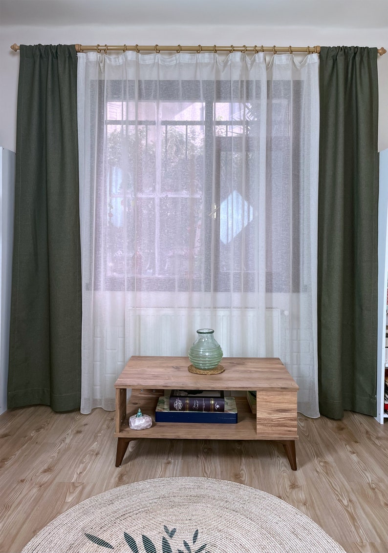 Khaki linen curtain on living room window.
