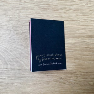 May include: A black book with the text "poems & illustrations by franziska beck www.franziskabeck.com" printed in white on the back cover.