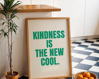 Puede incluir: Una impresión enmarcada con fondo blanco y una inscripción verde que dice "La amabilidad es lo nuevo cool."