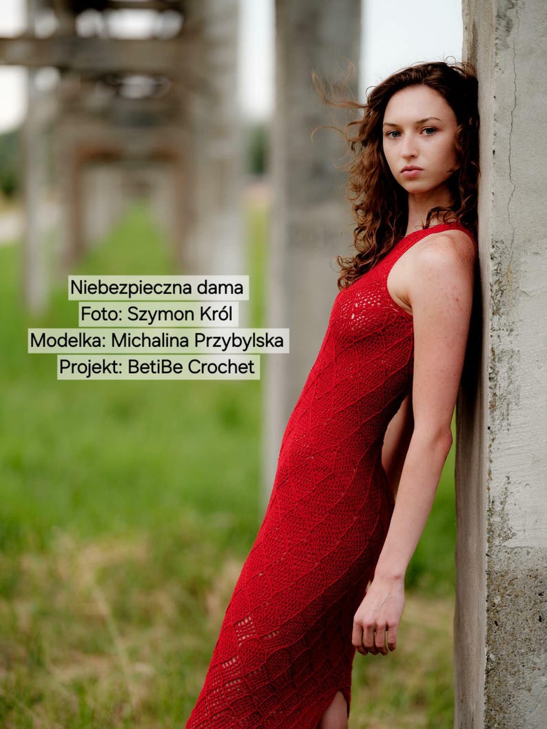 May include: A sleeveless, floor-length red crochet dress featuring a textured, repeating wave pattern. The dress includes the text: Niebezpieczna dama, Foto: Szymon Kr&oacute;l, Modelka: Michalina Przybylska, Projekt: BetiBe Crochet.