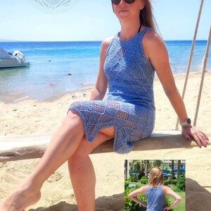 May include: A sleeveless, knee-length blue crochet dress featuring a repeating diamond pattern throughout the garment. The dress has a high neckline and a fitted silhouette, shown from both a front-facing perspective and a rear-facing view.