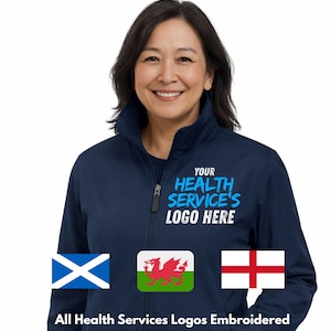 May include: A navy blue zip-up jacket with the text "YOUR HEALTH SERVICE'S LOGO HERE" in light blue. The jacket features embroidered flags of Scotland, Wales, and England. The text "All Health Services Logos Embroidered" is below the flags.