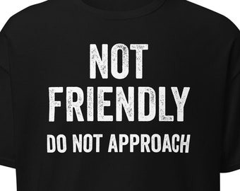 May include: Black t-shirt with white text that reads "NOT FRIENDLY DO NOT APPROACH".
