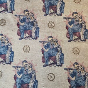 May include: Beige fabric with a repeating pattern of a sailor and child looking through a telescope. The sailor is seated in a chair with a ship's wheel behind him. The design includes ship's wheels and small sailboats.
