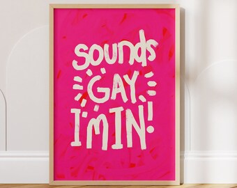 May include: A framed print with a pink background and white text that reads "Sounds Gay I'm In!"