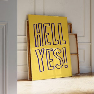 May include: A yellow canvas print with the text "HELL YES!" in blue lettering.