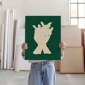 May include: A green poster featuring a minimalist illustration of two hands clasped together. The hands are beige with light blue nail polish.