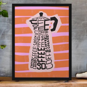 May include: A framed print with an orange and pink striped background. The print features a stylized image of a coffee pot made up of the word "coffee" repeated many times.