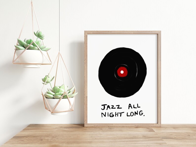 May include: A framed print with a black and white illustration of a vinyl record with a red center. The text "JAZZ ALL NIGHT LONG." is written in black below the record.