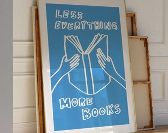May include: A blue poster with white text that reads "Less Everything More Books". A white outline of a book is shown with two hands holding it open.