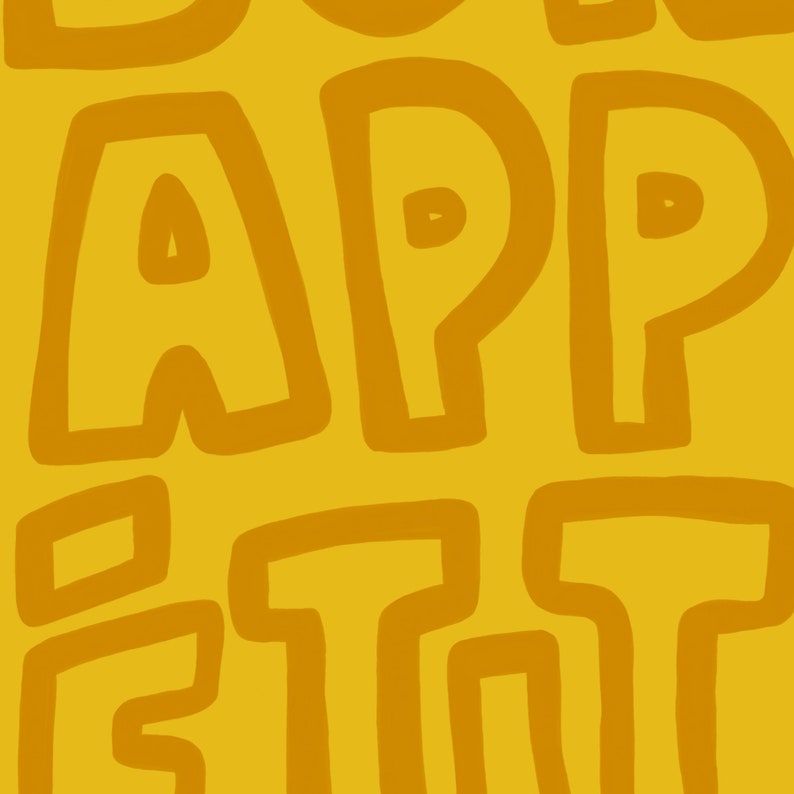 May include: A yellow background with the words "Bon Appetit" written in a brown, outlined font.