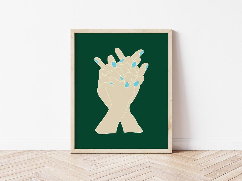 May include: Two hands with light blue nail polish are intertwined against a dark green background.