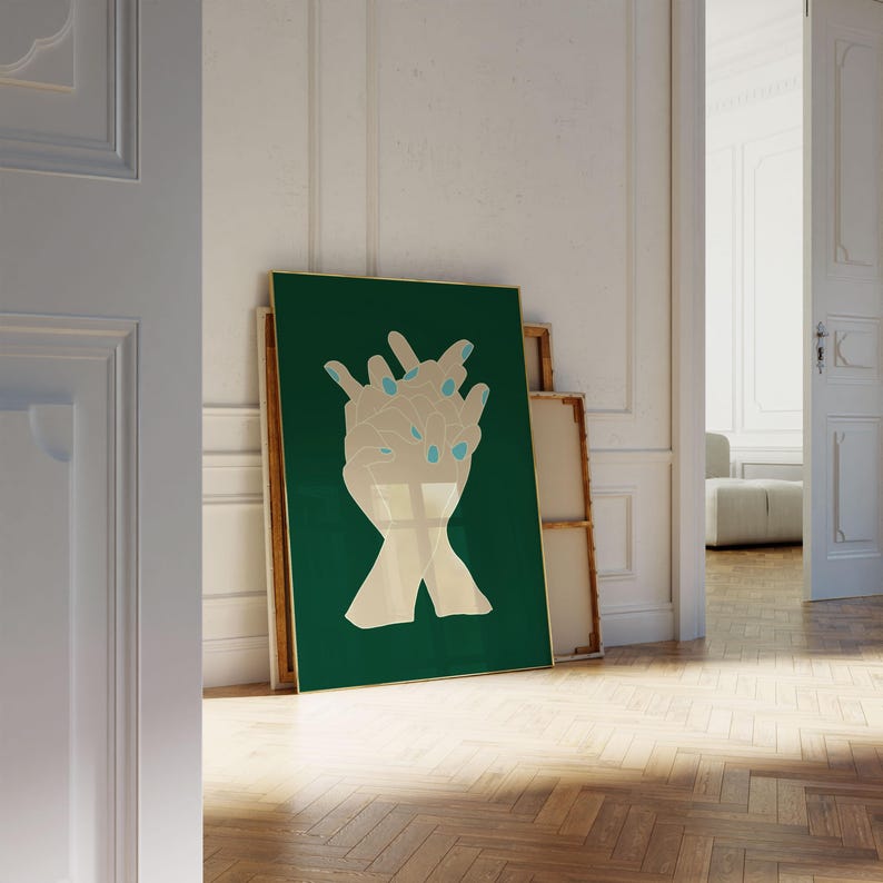 May include: A green canvas print with a gold frame featuring a stylised image of two hands clasped together. The hands are outlined in gold and have blue accents on the fingertips.
