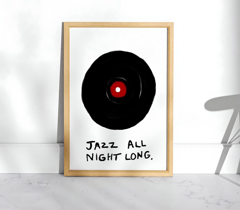 May include: A framed print with a black and white illustration of a vinyl record with a red center. The text "JAZZ ALL NIGHT LONG." is written below the record.