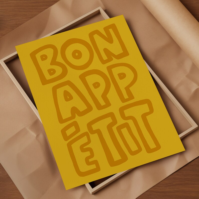 May include: A yellow poster with the words "BON APPETIT" written in a bold, stylized font.