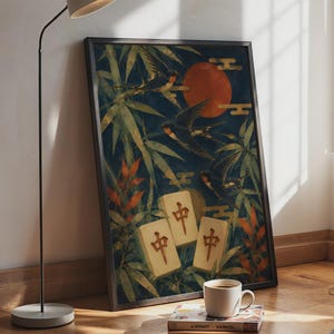 May include: A framed vertical wall art print featuring three mahjong tiles with the red Chinese character for middle, surrounded by dark green bamboo leaves, orange foliage, three flying swallows, and a large red sun against a dark blue background.