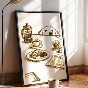 Puede incluir: Una lámina artística enmarcada con una ilustración en tonos sepia de una escena de desayuno. La obra muestra a un perro asomándose por encima de una mesa, una cafetera de émbolo, una taza de café humeante, un cruasán, mermelada y un periódico.