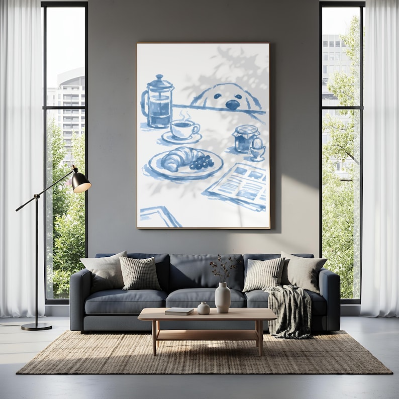 May include: A framed wall art print featuring a blue and white watercolour illustration of a breakfast scene with a French press, a cup of coffee, a croissant, a jam jar, a soft-boiled egg, a newspaper, and a dog peeking over the table edge.