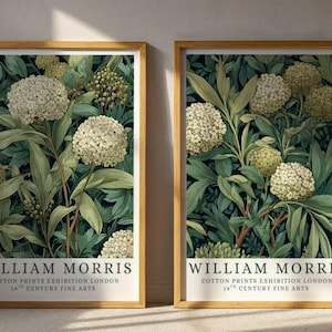 May include: Two framed art prints featuring a floral design with white, green, and dark green hues. The prints include the text "WILLIAM MORRIS COTTON PRINTS EXHIBITION LONDON 19TH CENTURY FINE ARTS" at the bottom.