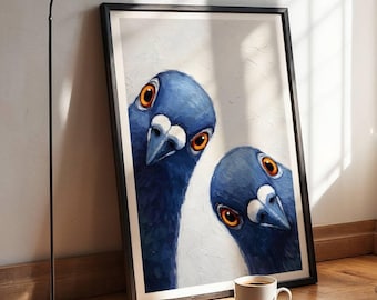 May include: A framed wall art print featuring an oil painting of two blue pigeons with bright orange eyes looking directly forward. The birds are set against a textured off-white background, captured in a vertical orientation with a black frame.