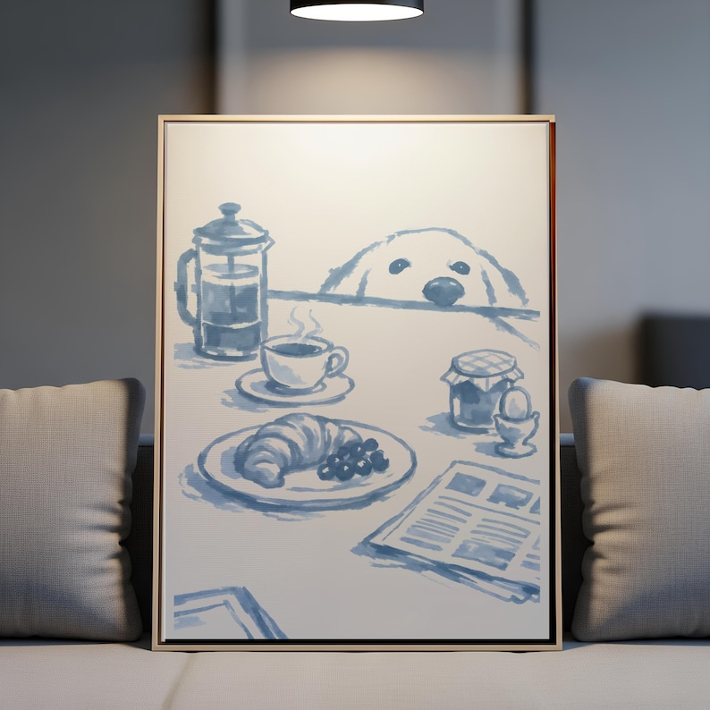 May include: A framed wall art print featuring a blue and white watercolour illustration of a breakfast table. The scene includes a French press, a cup of coffee, a croissant with berries, a jar, a soft-boiled egg, a newspaper, and a dog peeking.