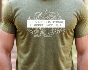 May include: A green t-shirt with a white graphic design of a topographic map and the text "If it's not on Strava, it never happened."