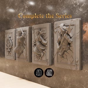 May include: Four playing card-shaped wall art pieces with relief sculptures of figures. The cards are gray and mounted on a textured wall. The text "Complete the Series" is in gold. The cards feature a king, queen, and jack.
