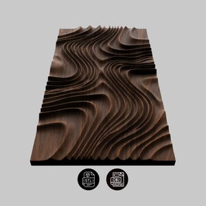 May include: A dark brown, rectangular wooden wall art piece with a topographic design. The artwork features layered, undulating lines that create a three-dimensional effect. The piece has a smooth finish and is likely made of solid wood. Includes STL and OBJ file icons.