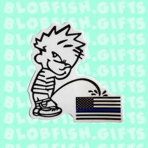 May include: A black and white cartoon character urinating on an American flag with a thin blue line. The flag is white with red and black stripes and a blue stripe with a thin white line.