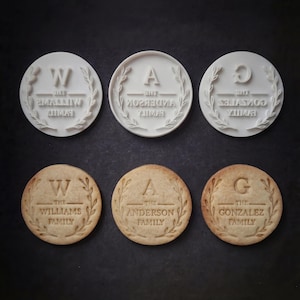 May include: A set of three ceramic mugs with a speckled, matte finish. The mugs are in shades of cream, light gray, and dark gray. Each mug has a simple, minimalist design, perfect for coffee or tea.