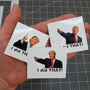 May include: Three white square stickers with a photo of a man in a suit pointing and the text "I did THAT!" on each sticker.