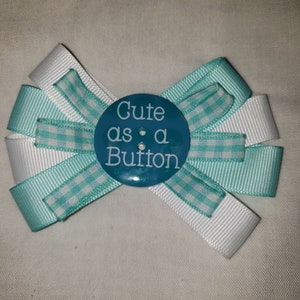 Hair bow. White and light blue grosgrain ribbon 3 1/2 inch hair bow on alligator clip