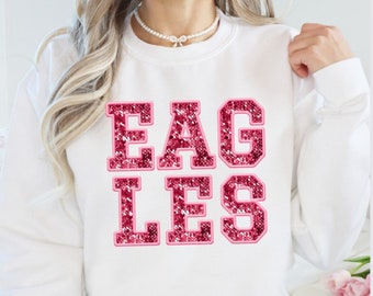 Eagles finto ricamo paillettes PNG aquile rosa sublimazione design sport mascotte grafica spirito scolastico design digitale vai al design delle aquile