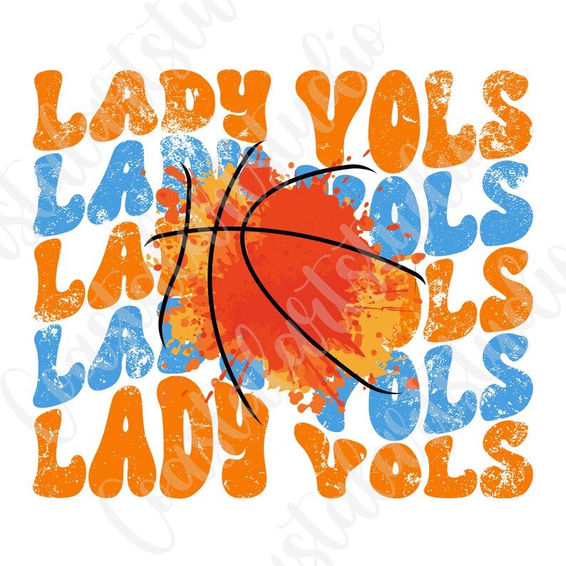 May include: Orange and blue graphic with the text "Lady Vols" repeated multiple times. A basketball with orange and yellow paint splatters is in the center of the design.