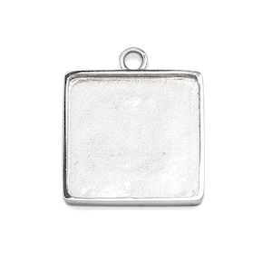 May include: Silver square pendant tray with a loop at the top for hanging.