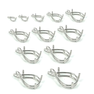 May include: Assortment of ten silver-toned pendant settings in various sizes. Each setting features a pear-shaped bezel with a smooth, polished finish. The bezels are designed to hold a variety of stones or cabochons.