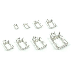 May include: Assortment of silver-toned metal pendant settings for rectangular gemstones. The settings are available in various sizes.